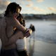 A couple embraces as they watch the first sunrise of the new year on Bondi Beach in Australia.